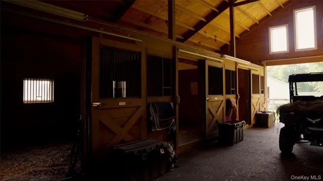 a front view of a house with a yard and green space