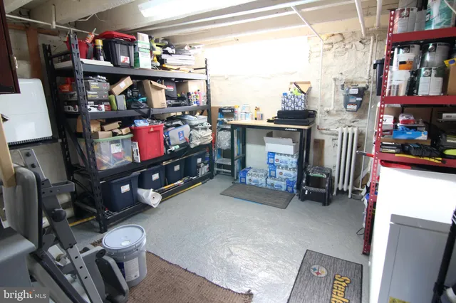 a room with lots of books and a large window
