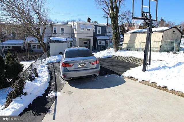 a swimming pool with outdoor seating and yard