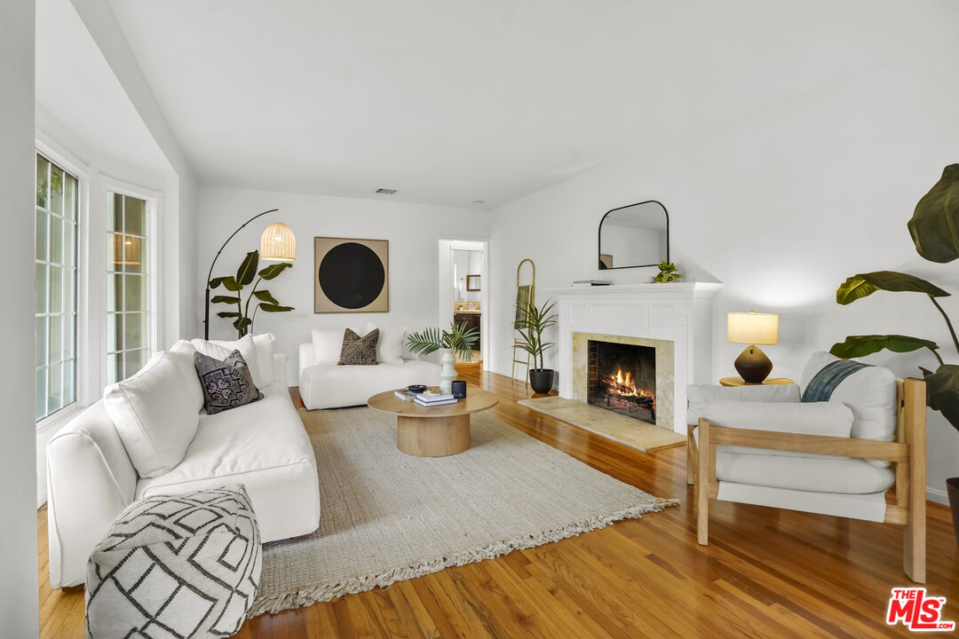 10129 Plainview Avenue Tujunga, CA 91042 - Photo 1 of 51 a living room with furniture and a fireplace