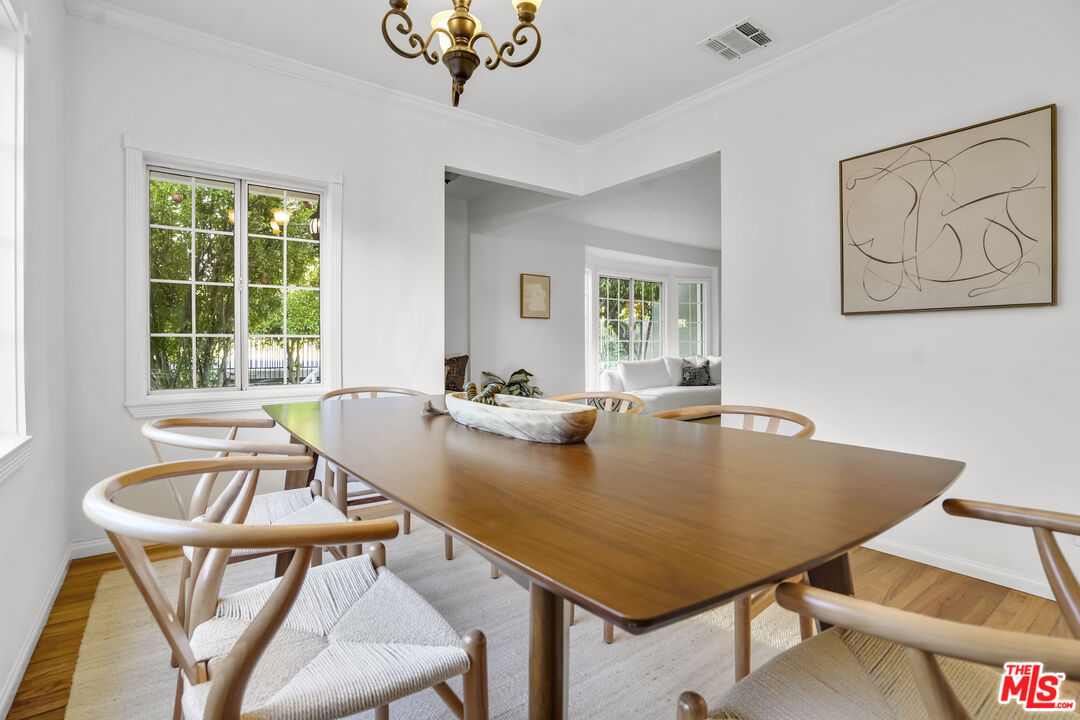 10129 Plainview Avenue Tujunga, CA 91042 - Photo 13 of 51 a view of a dining room with furniture and a window