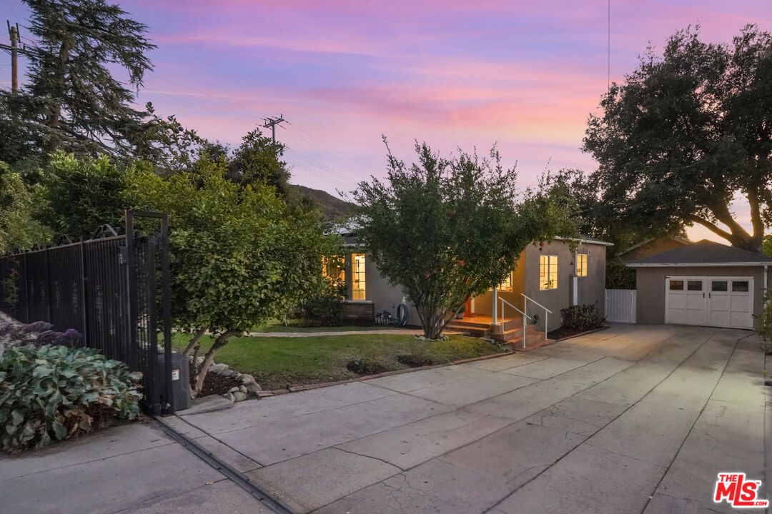 10129 Plainview Avenue Tujunga, CA 91042 - Photo 2 of 51 a view of a house with garden and trees