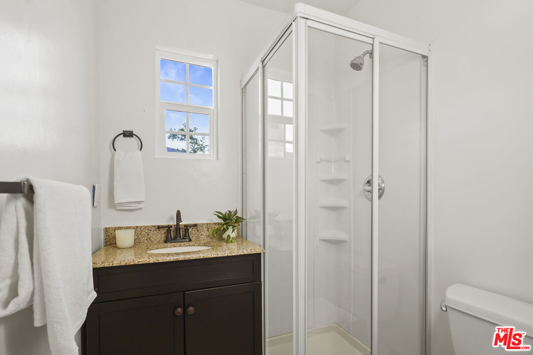 10129 Plainview Avenue Tujunga, CA 91042 - Photo 29 of 51 a bathroom with a sink a toilet and shower