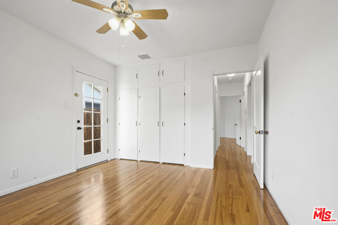 10129 Plainview Avenue Tujunga, CA 91042 - Photo 31 of 51 a view of empty room with wooden floor