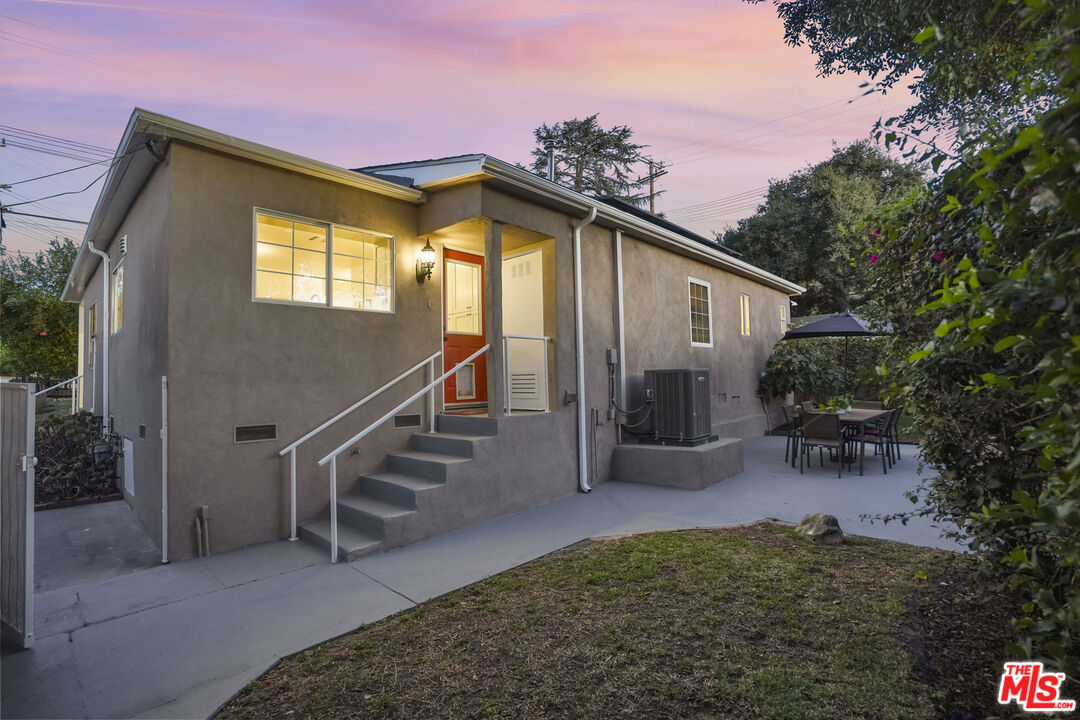 10129 Plainview Avenue Tujunga, CA 91042 - Photo 43 of 51 a view of a house with a small yard and large tree