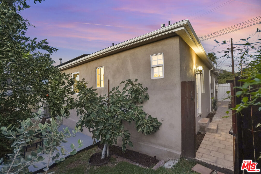 10129 Plainview Avenue Tujunga, CA 91042 - Photo 46 of 51 a front view of a house with garden