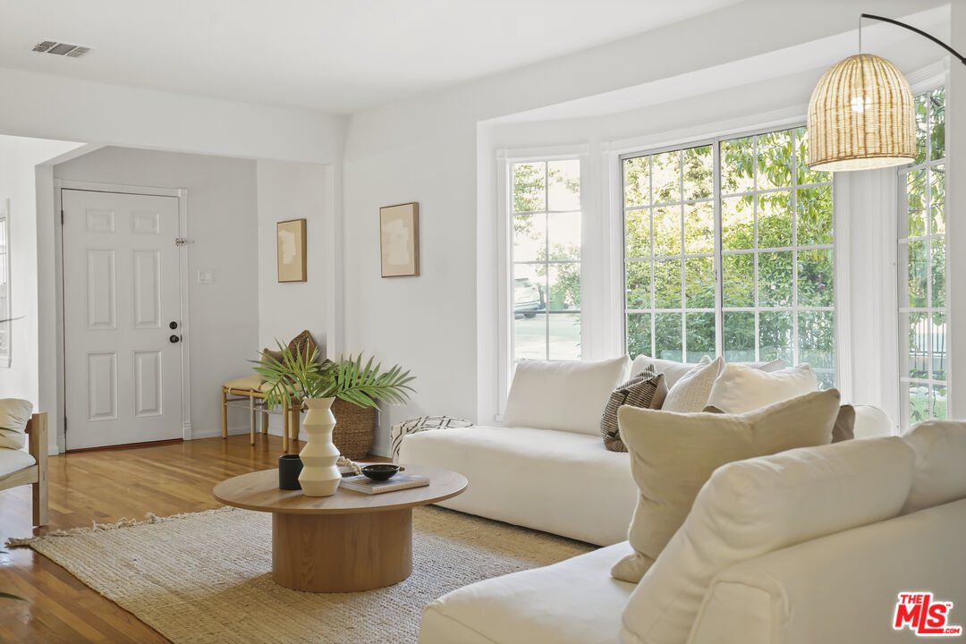 10129 Plainview Avenue Tujunga, CA 91042 - Photo 7 of 51 a living room with furniture and a potted plant