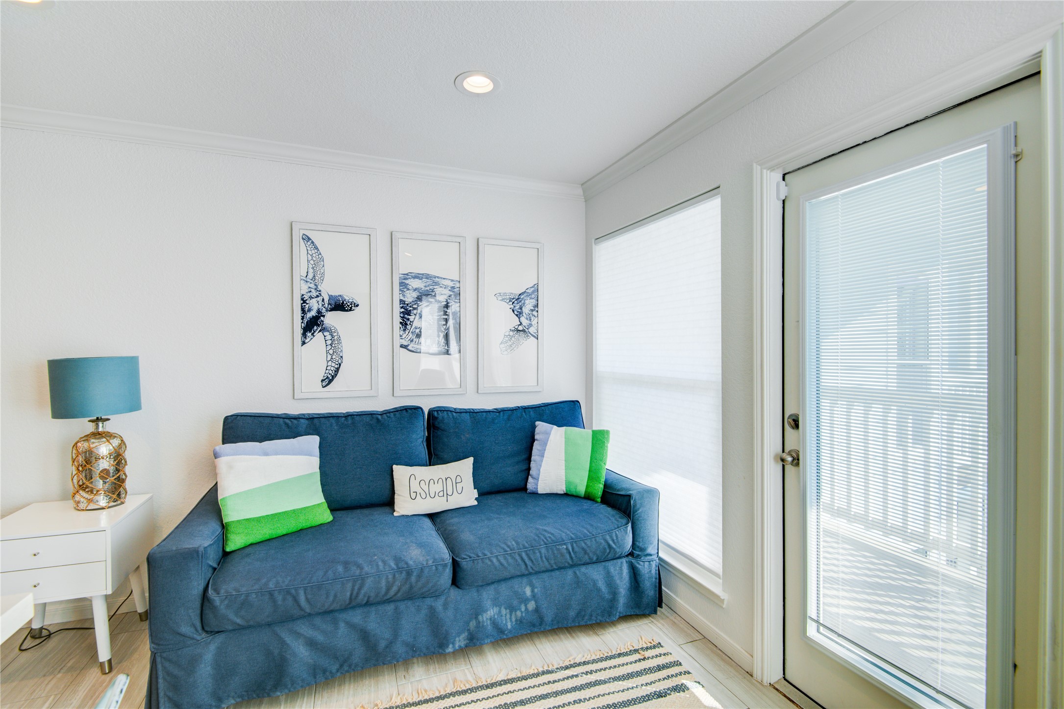 10811 Termini-San Luis Pass Road, Unit 2307 Galveston, TX 77554 - Photo 21 of 32 a living room with furniture and a window