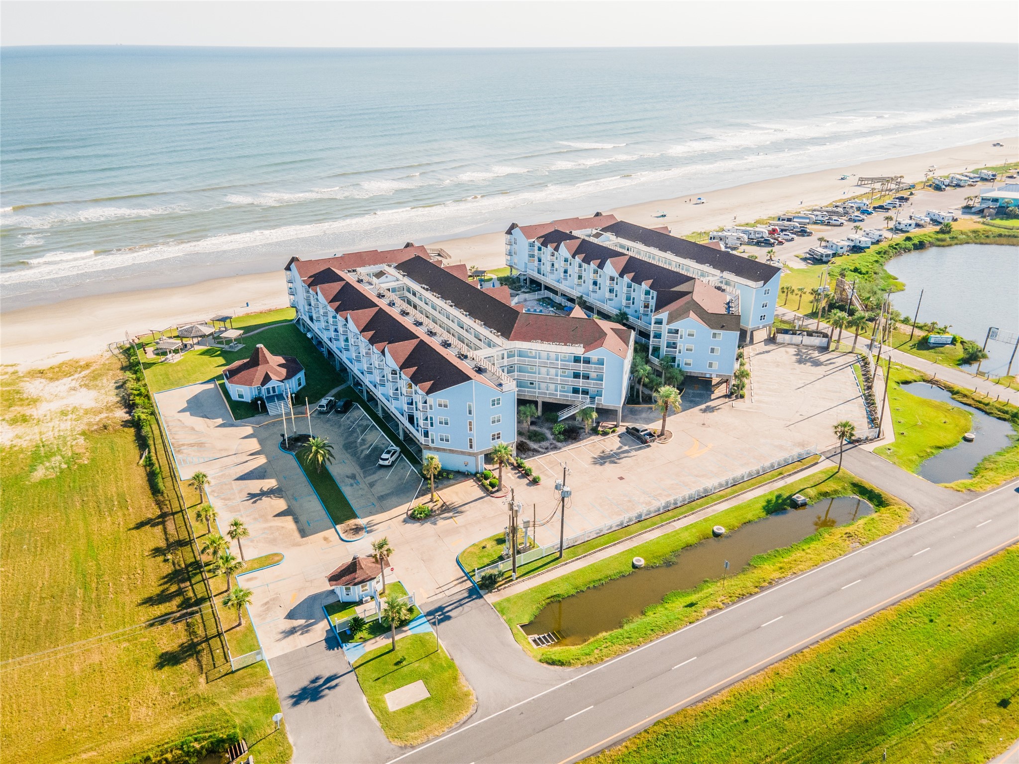 10811 Termini-San Luis Pass Road, Unit 2307 Galveston, TX 77554 - Photo 26 of 32 a view of a swimming pool with a patio