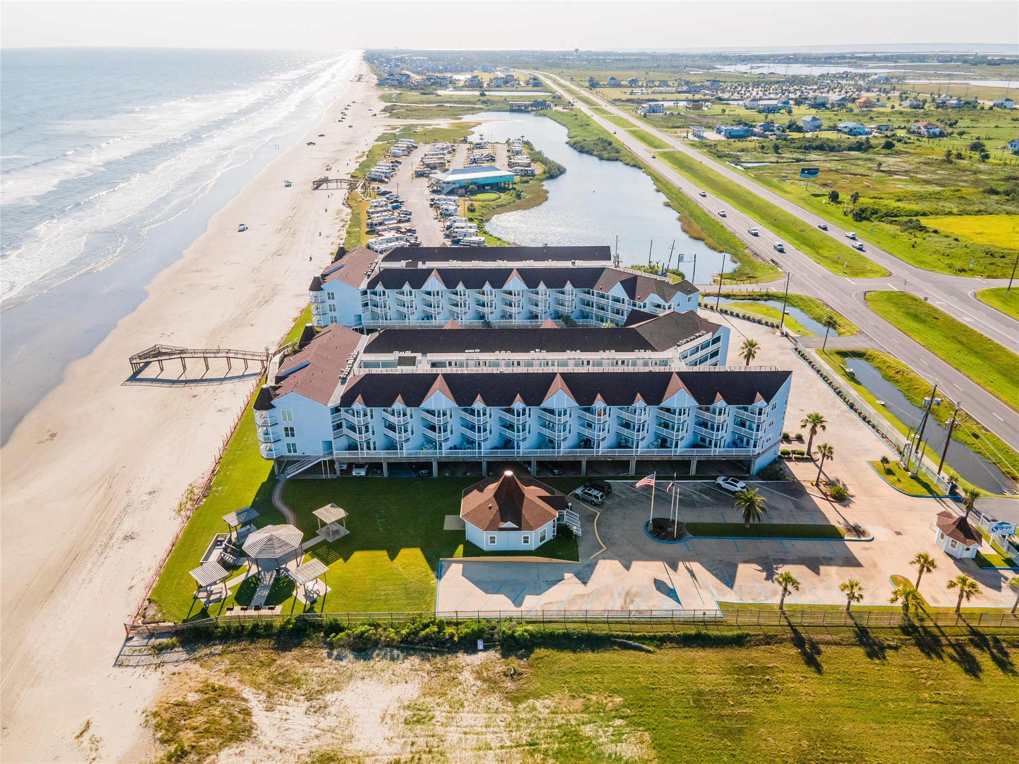 10811 Termini-San Luis Pass Road, Unit 2307 Galveston, TX 77554 - Photo 29 of 32 an aerial view of a house with swimming pool