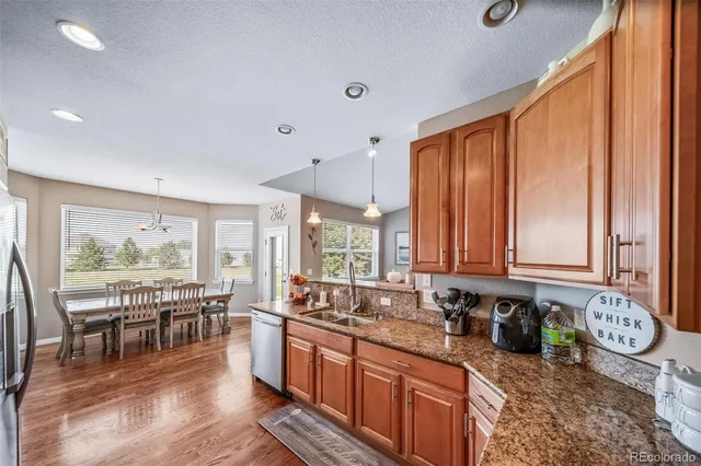 a large kitchen with lots of counter space and windows