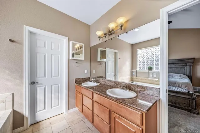 a bathroom with a sink a vanity and a mirror