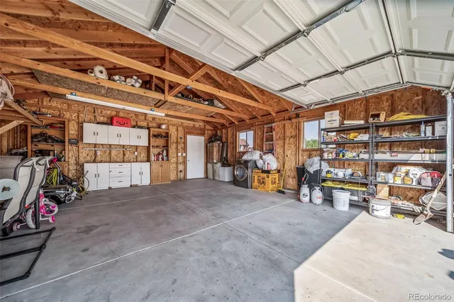 a view of a garage with storage