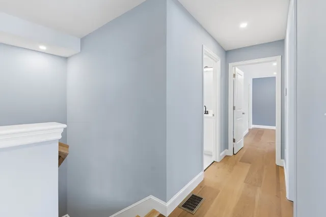 a view of a hallway with toilet