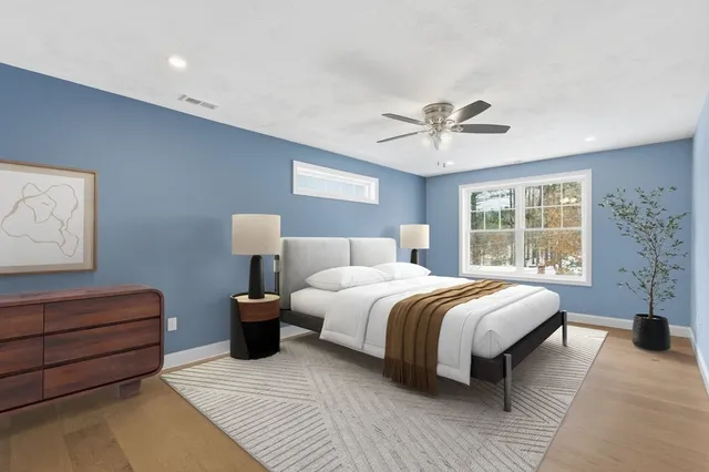 a bedroom with a bed and window