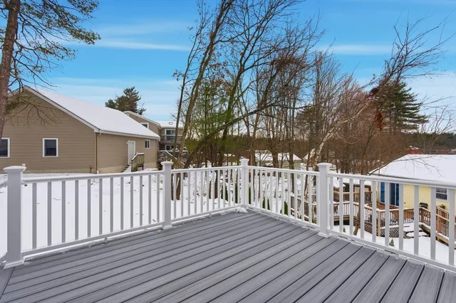 a view of a wooden chairs on deck