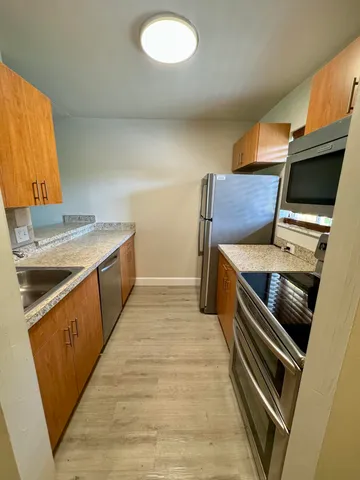 a kitchen with a stove and a sink