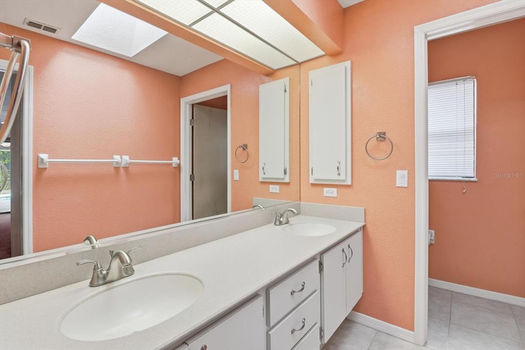 22 Mastic Court West Homosassa, FL 34446 - Photo 24 of 46 a bathroom with a double vanity sink and a mirror