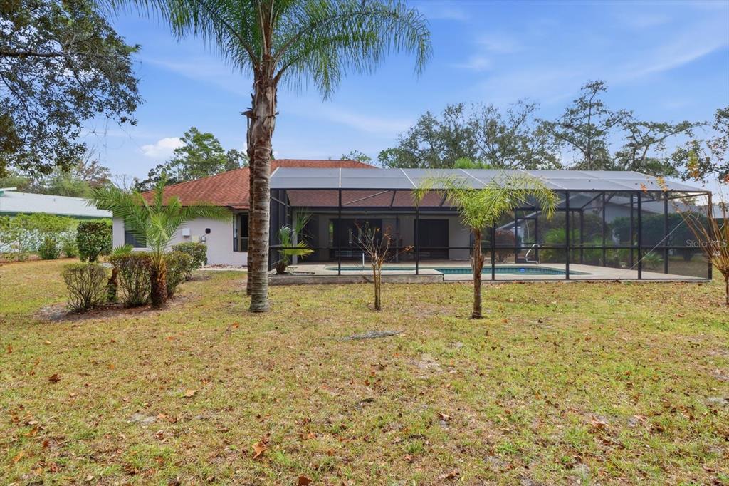 22 Mastic Court West Homosassa, FL 34446 - Photo 40 of 46 a swimming pool with outdoor seating and yard