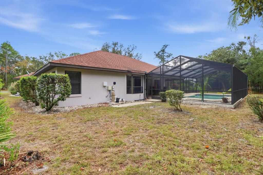 22 Mastic Court West Homosassa, FL 34446 - Photo 41 of 46 a view of a house with backyard and sitting area