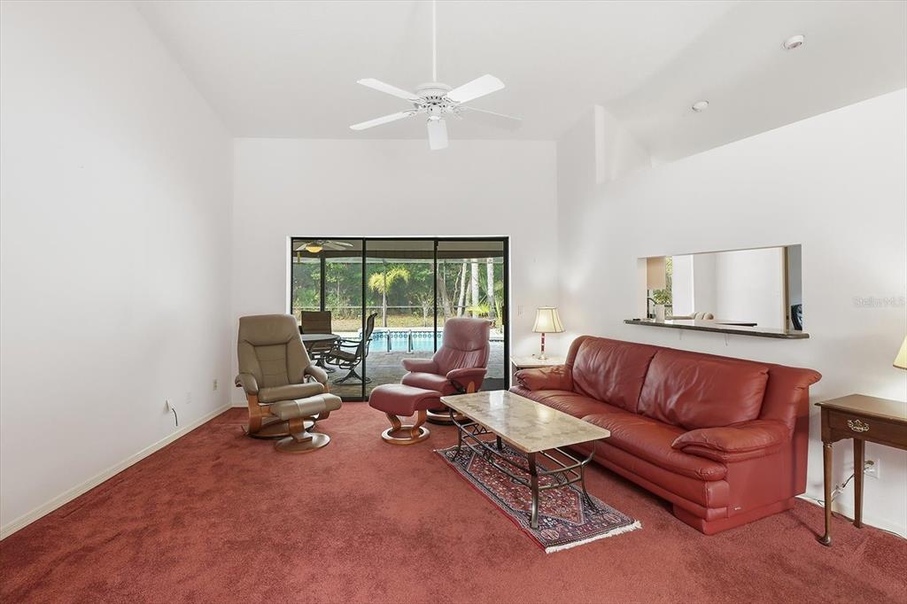 22 Mastic Court West Homosassa, FL 34446 - Photo 9 of 46 a living room with furniture and a window