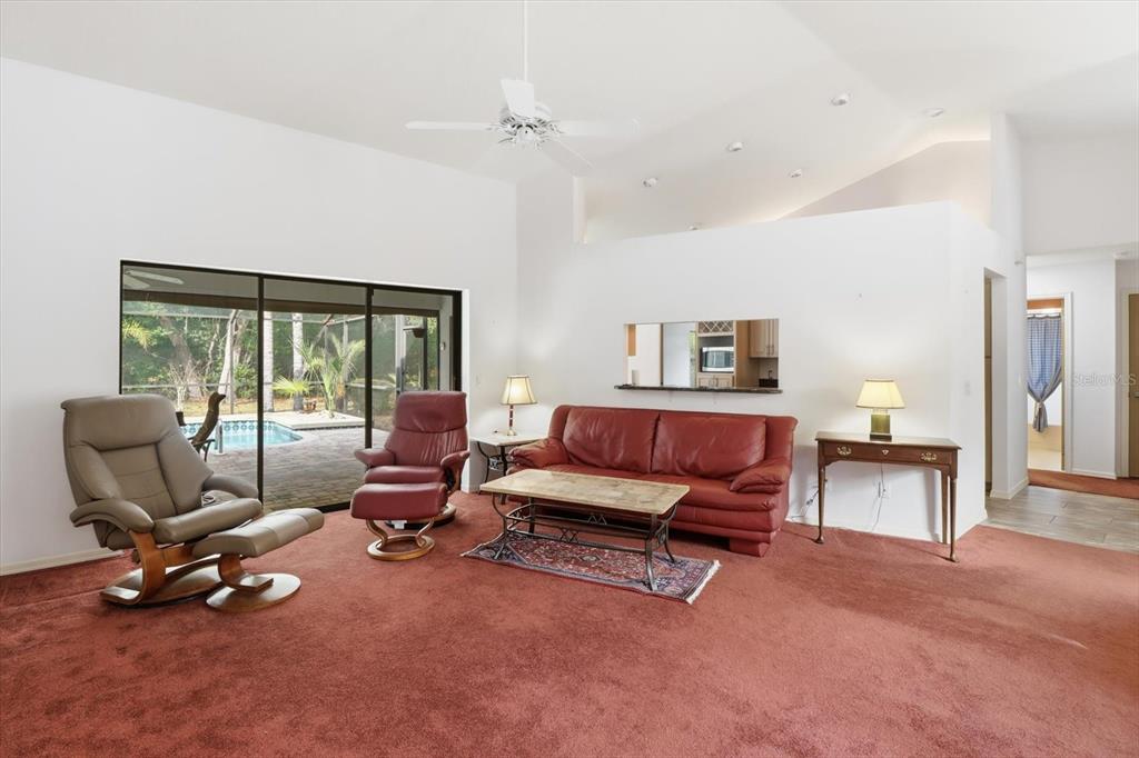 22 Mastic Court West Homosassa, FL 34446 - Photo 10 of 46 a living room with furniture gym equipment and a large window