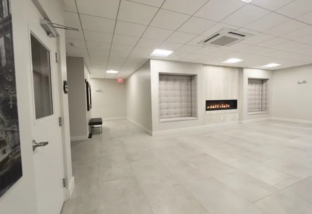 a view of a hallway with a room