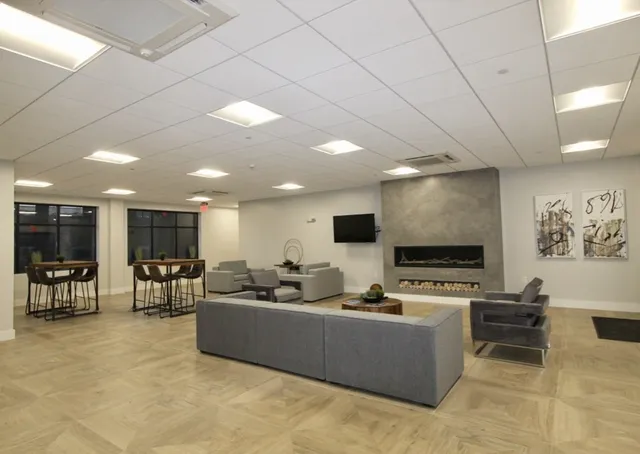 a living room with furniture and a flat screen tv