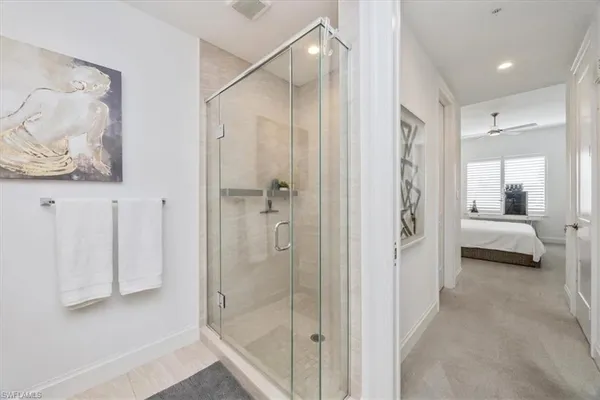 a bedroom with a bed and ceiling fan