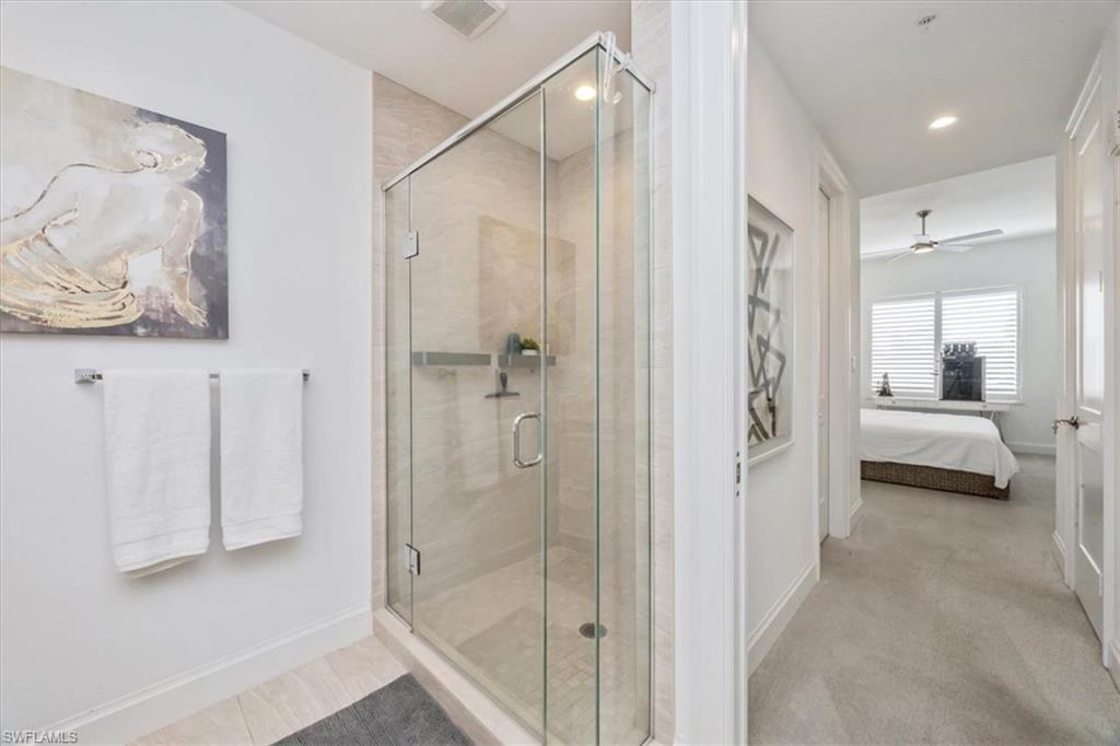 1111 Central Avenue, Unit 401 Naples, FL 34102 - Photo 17 of 36 a bathroom with a shower and a sink
