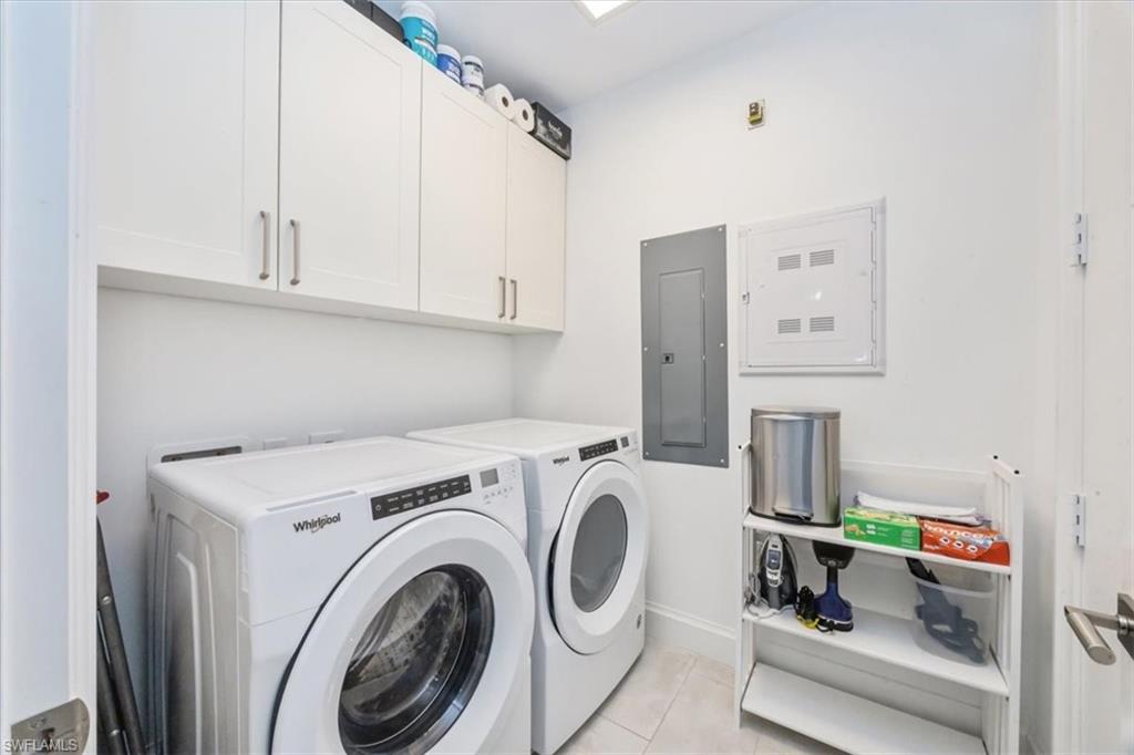 1111 Central Avenue, Unit 401 Naples, FL 34102 - Photo 22 of 36 a utility room with dryer and washer