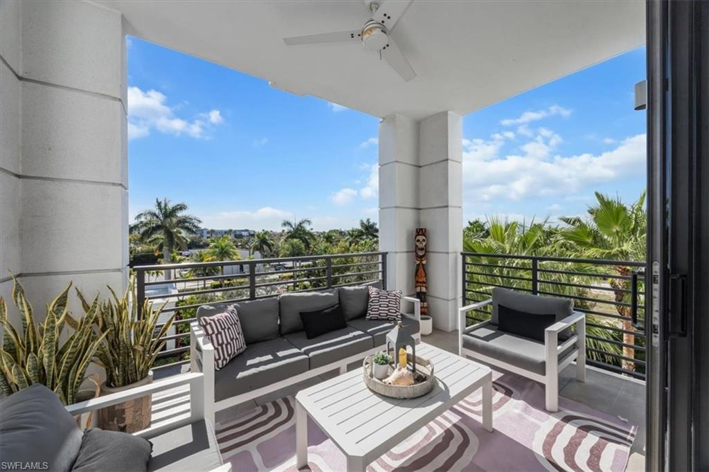 1111 Central Avenue, Unit 401 Naples, FL 34102 - Photo 3 of 36 a outdoor living room with furniture