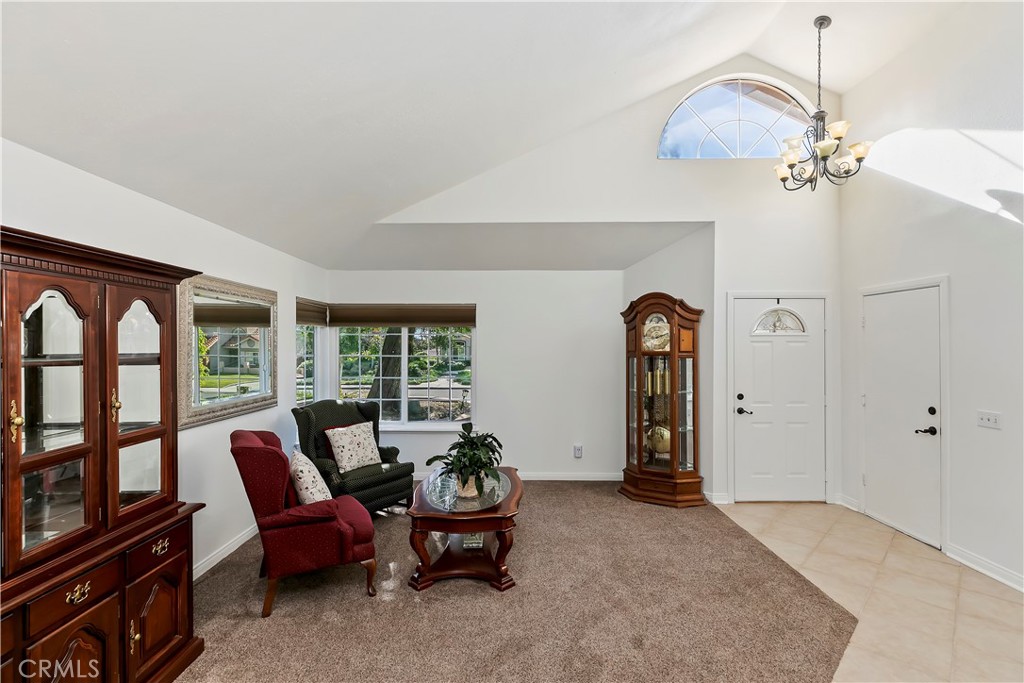 276 Cottonwood Avenue Riverside, CA 92506 - Photo 11 of 69 a living room with furniture and a large window