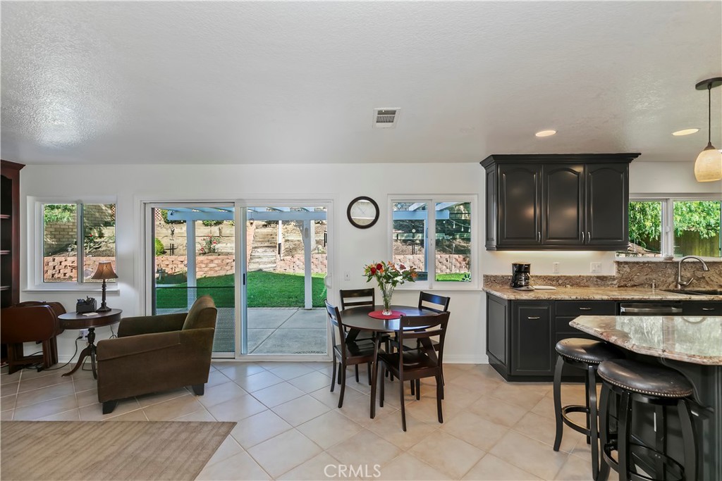 276 Cottonwood Avenue Riverside, CA 92506 - Photo 17 of 69 a living room with lots of furniture and a large window