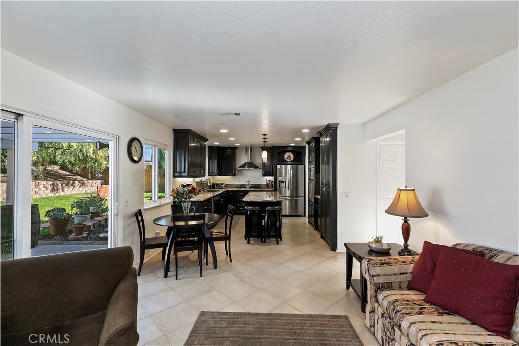 276 Cottonwood Avenue Riverside, CA 92506 - Photo 19 of 69 a living room with furniture and a large window
