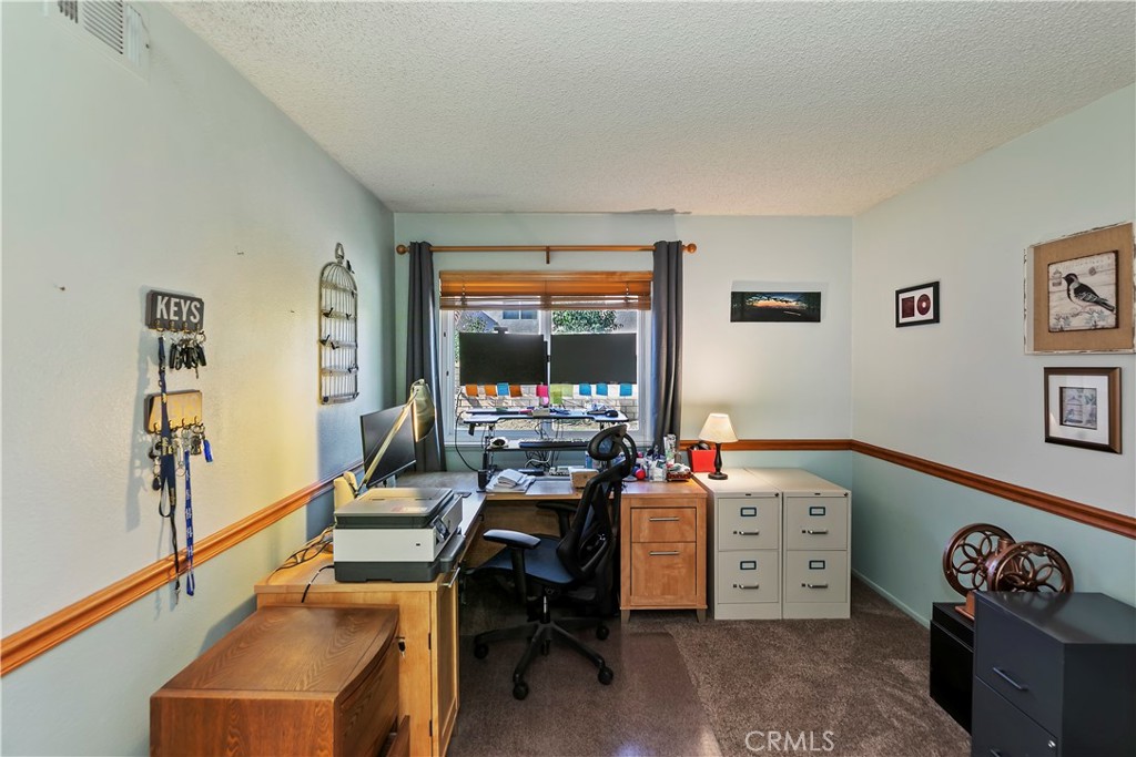 276 Cottonwood Avenue Riverside, CA 92506 - Photo 22 of 69 a room with furniture and a window