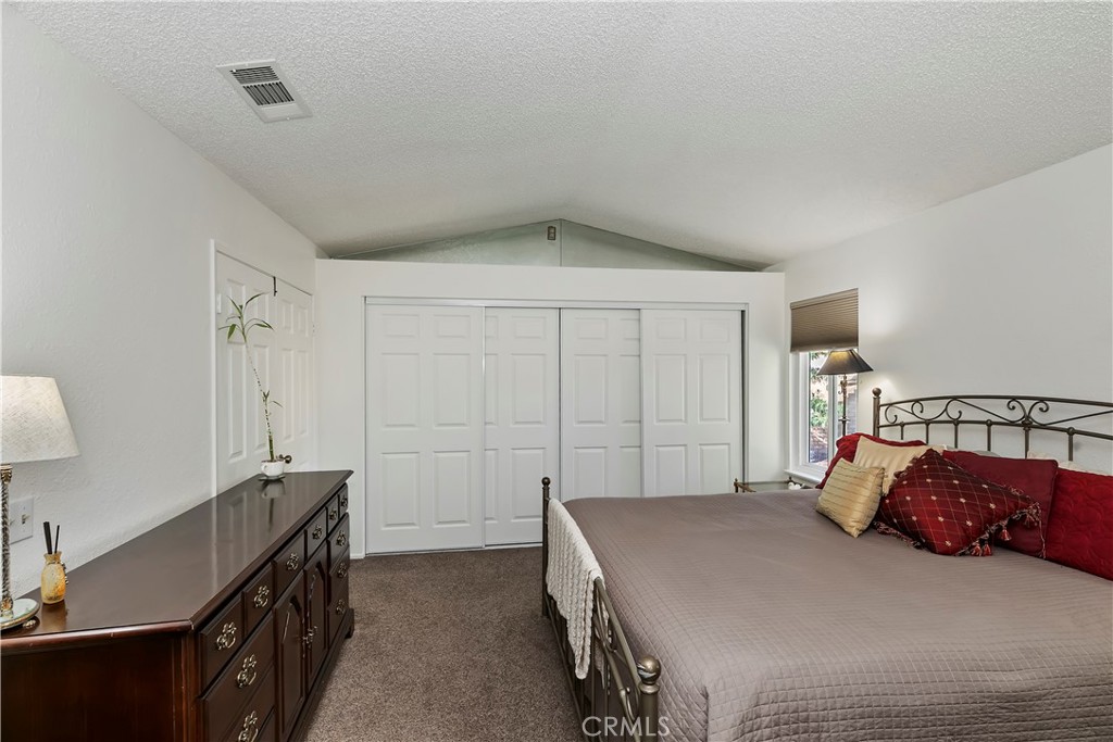 276 Cottonwood Avenue Riverside, CA 92506 - Photo 29 of 69 a bedroom with a bed and a dresser