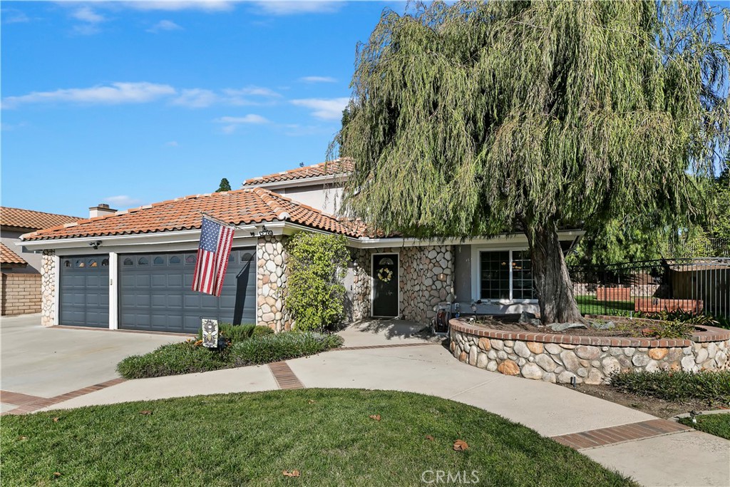 276 Cottonwood Avenue Riverside, CA 92506 - Photo 4 of 69 a front view of a house with garden