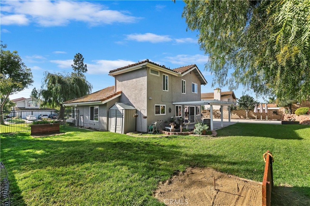 276 Cottonwood Avenue Riverside, CA 92506 - Photo 46 of 69 a front view of a house with garden