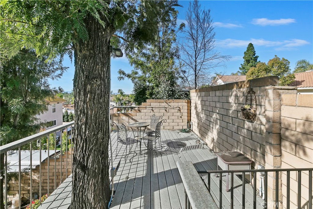 276 Cottonwood Avenue Riverside, CA 92506 - Photo 50 of 69 a view of balcony with wooden floor and fence