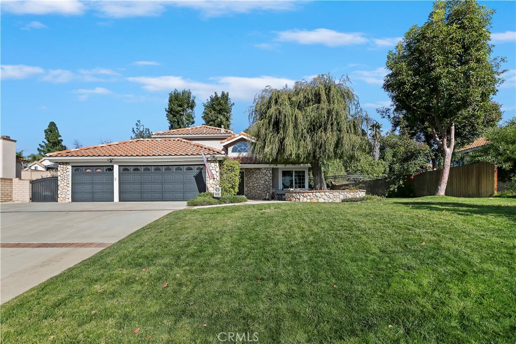 276 Cottonwood Avenue Riverside, CA 92506 - Photo 60 of 69 a front view of a house with garden