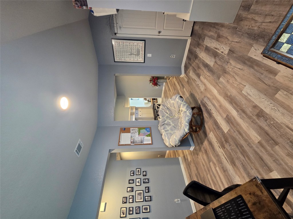 444 Hunter Loop Bertram, TX 78605 - Photo 14 of 15 a bedroom with a bed and a table