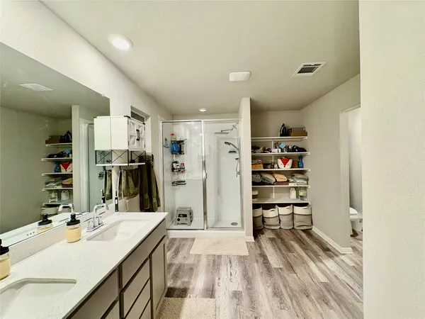 a bedroom with furniture and a bed