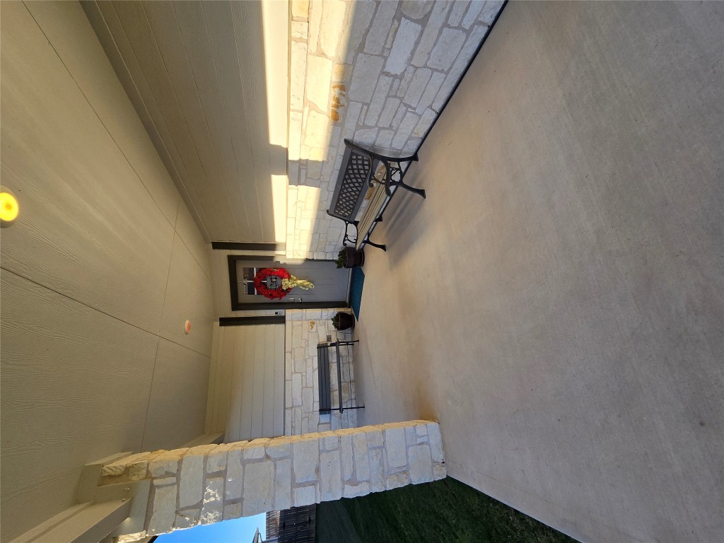 444 Hunter Loop Bertram, TX 78605 - Photo 3 of 15 a living room with furniture and a flat screen tv