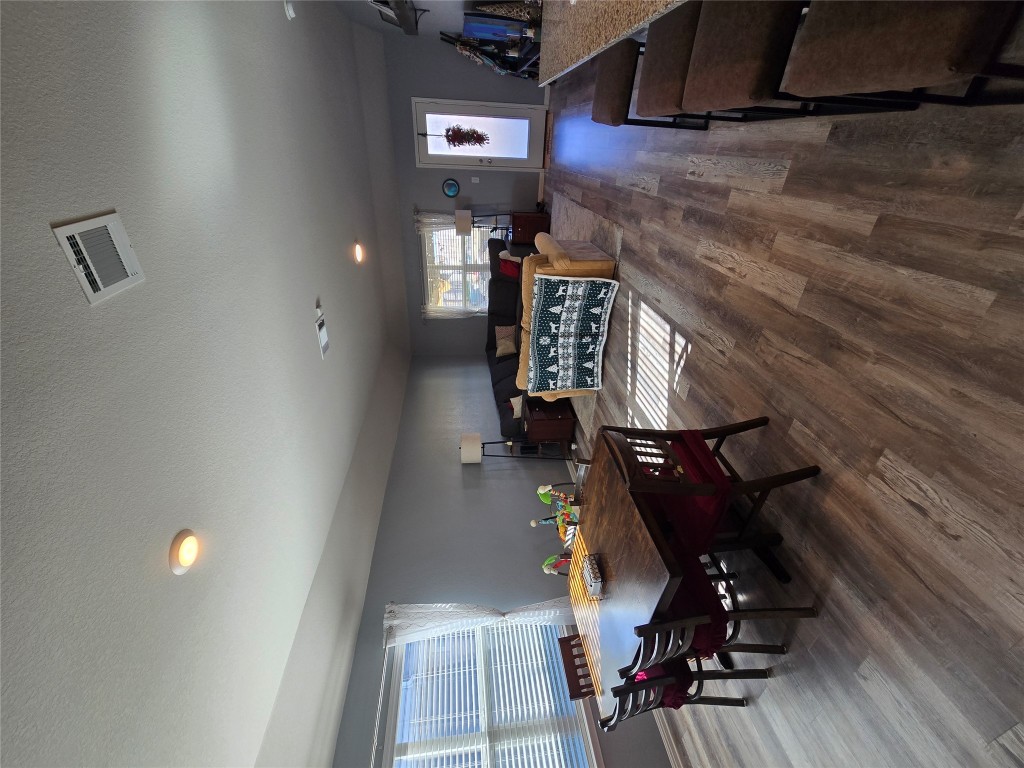444 Hunter Loop Bertram, TX 78605 - Photo 5 of 15 a view of a dining room with furniture and wooden floor