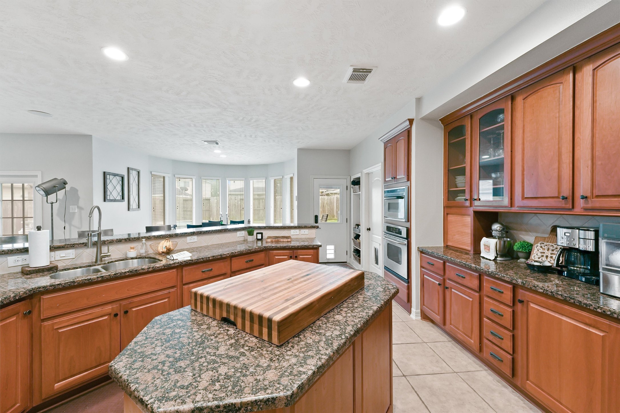 2818 Shallow Springs Court Manvel, TX 77578 - Photo 14 of 41 a kitchen with stainless steel appliances granite countertop a stove a sink and a refrigerator