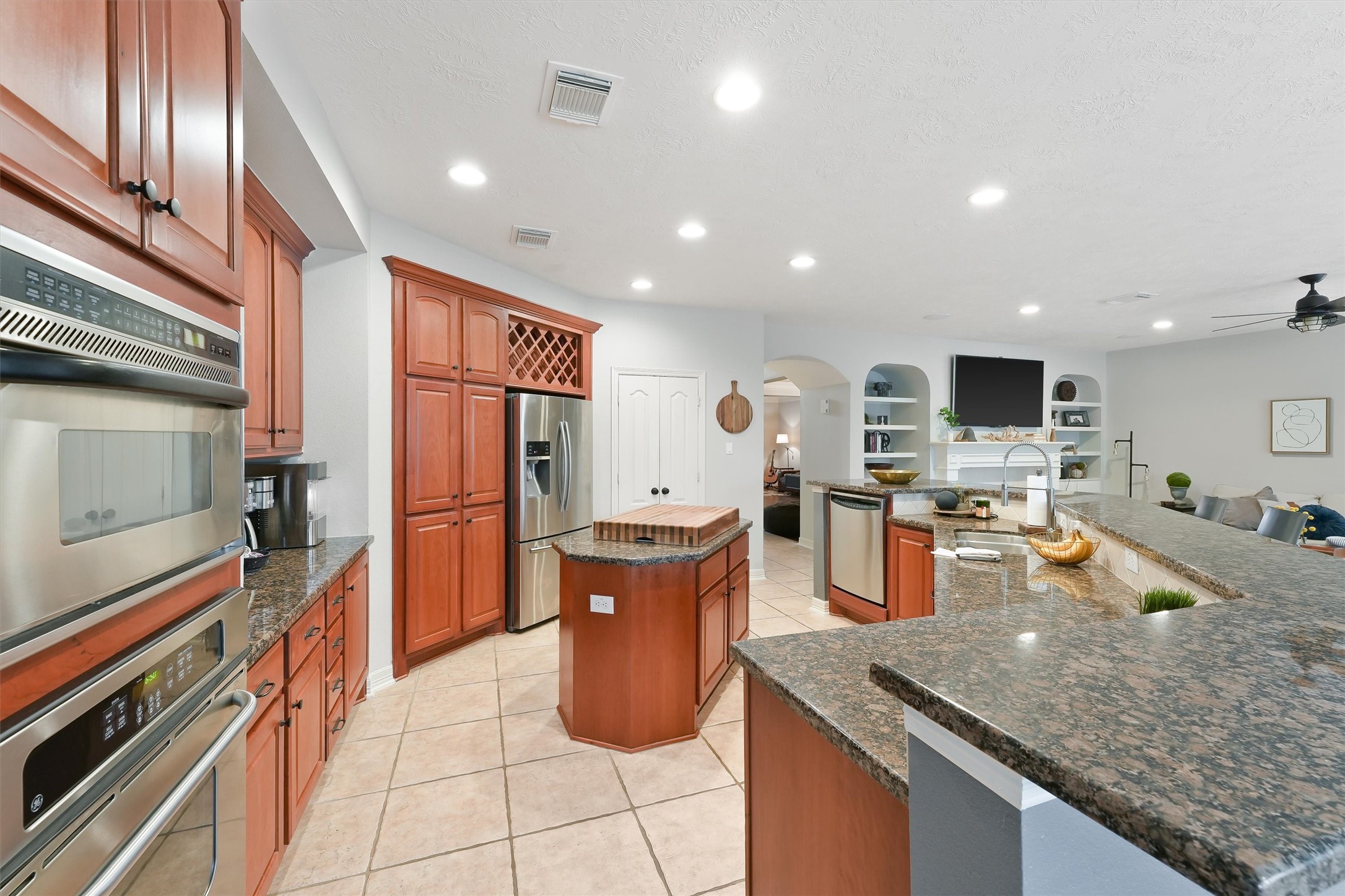 2818 Shallow Springs Court Manvel, TX 77578 - Photo 15 of 41 a kitchen with stainless steel appliances granite countertop a sink stove and refrigerator