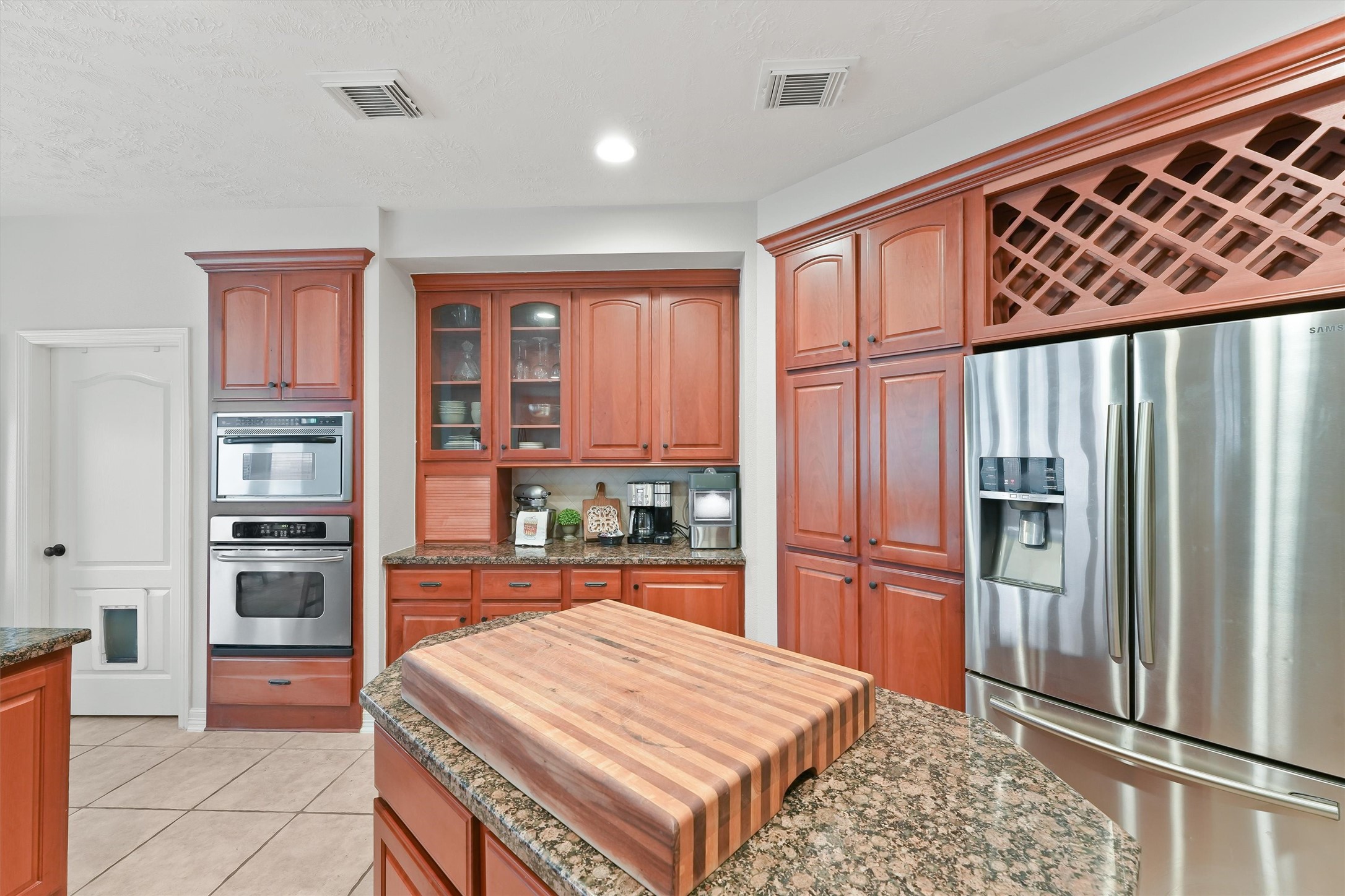 2818 Shallow Springs Court Manvel, TX 77578 - Photo 16 of 41 a kitchen with stainless steel appliances granite countertop a refrigerator and a sink