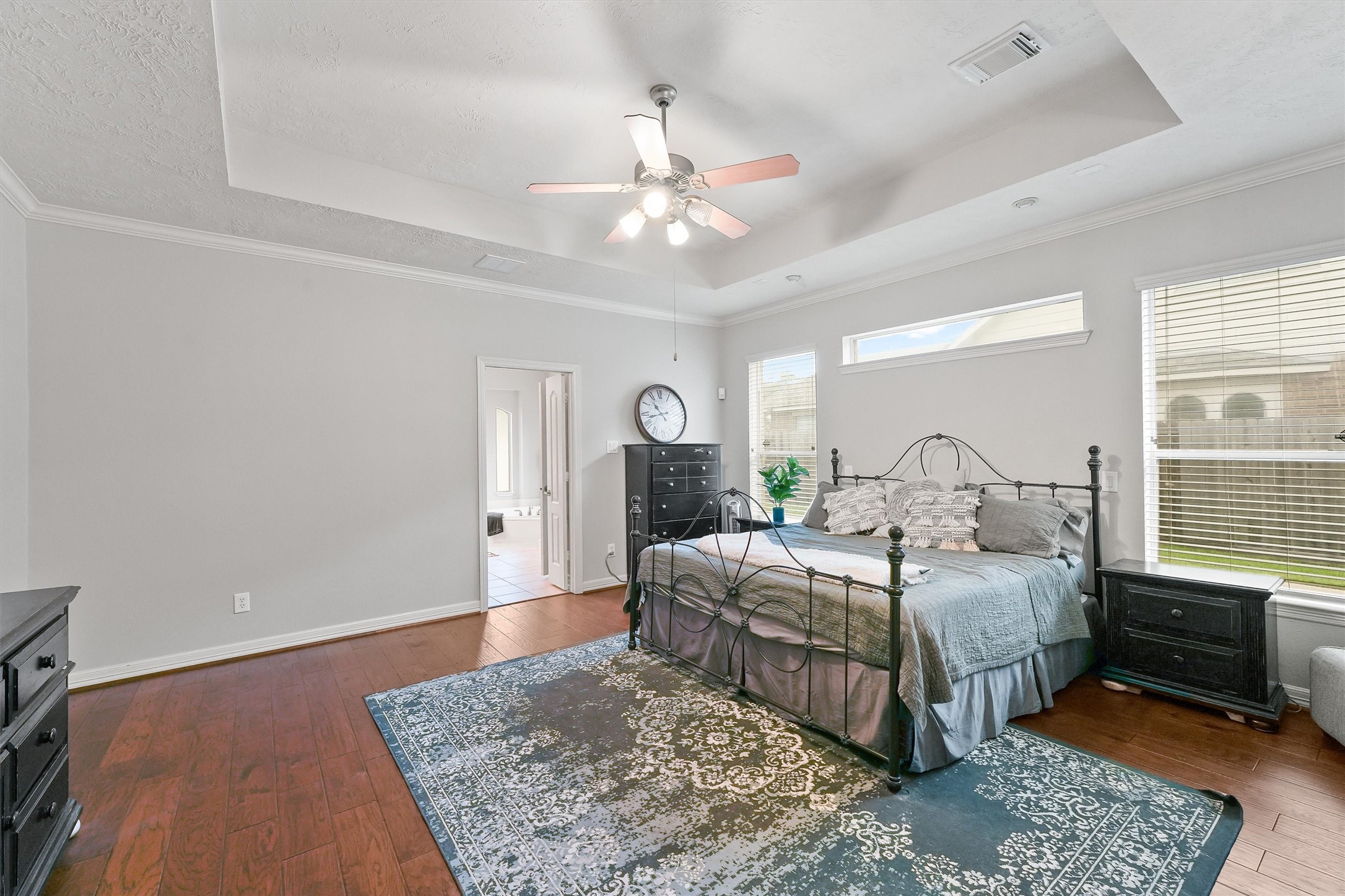2818 Shallow Springs Court Manvel, TX 77578 - Photo 19 of 41 a bedroom with a large bed and a chandelier