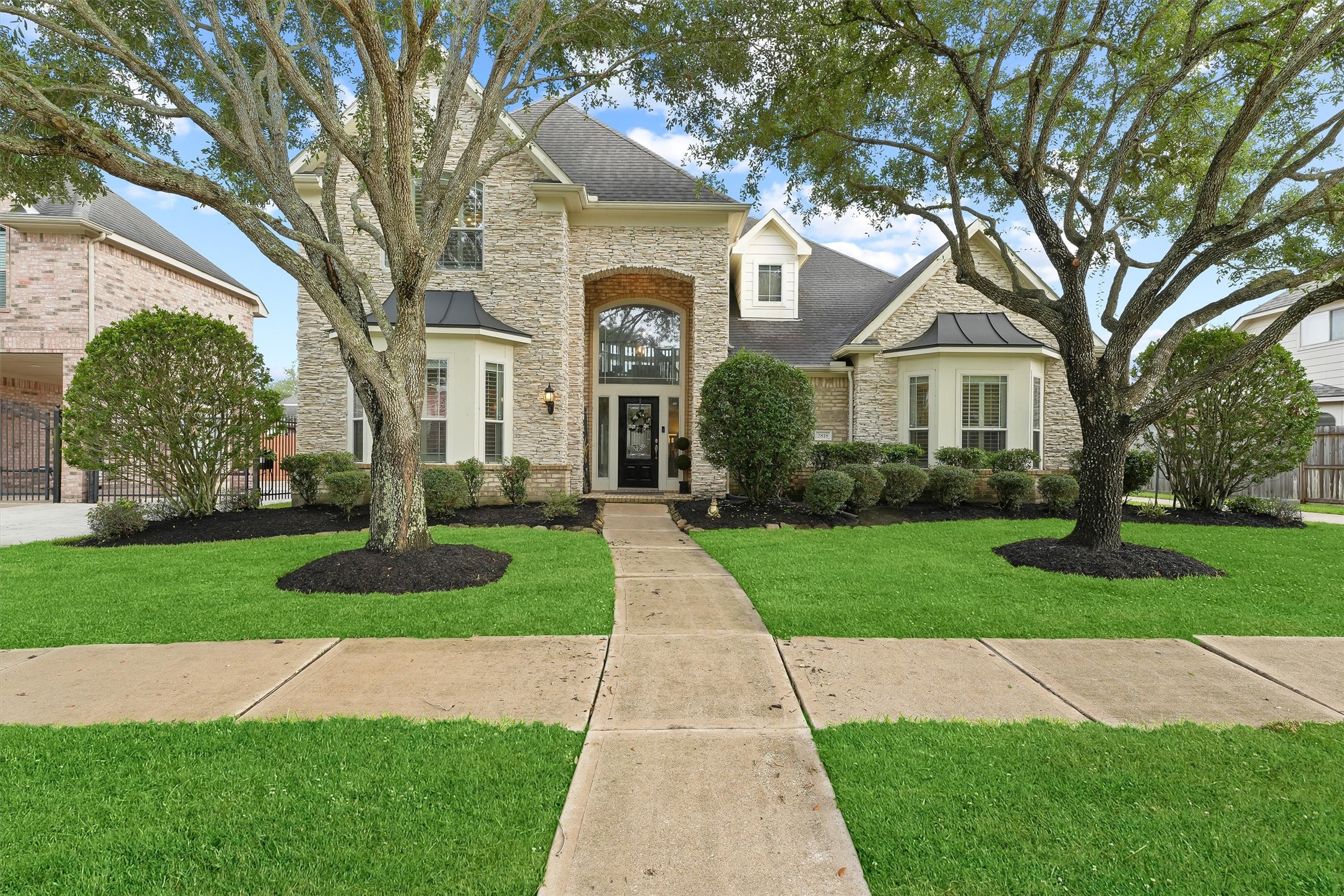 2818 Shallow Springs Court Manvel, TX 77578 - Photo 2 of 41 a front view of a house with a yard